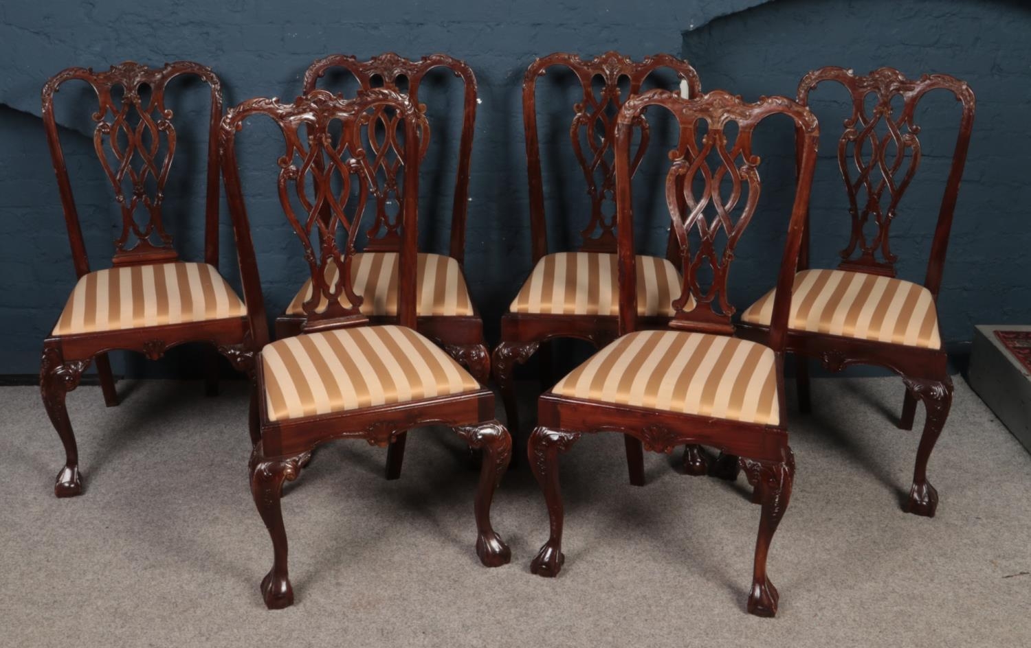 A set of six Mahogany Chippendale Style dining chairs. Comprising of upholstered striped seats. H: