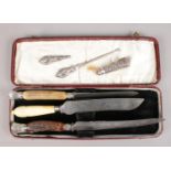 A collection of silver mounted/handled items. Includes carving knives, button hook etc.