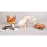 A group of Beswick figures. Pig sitting, Fox lying, Barn Owl, Hen in Basket, Long Haired Cat. (