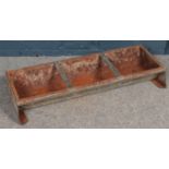 A galvanised steel feeding trough. (90cm long)