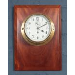 A Tempora brass mechanical ships clock on a mahogany mount. (with key).