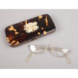 A pair of gold plated spectacles in monogrammed tortoise shell case. Spectacles stamped Algha 12KT