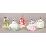 A group of Royal Doulton figurines. 'Emma' HN 3208, 'Buttercup' HN 3268, 'Sara' HN 3219, 'Rebecca'