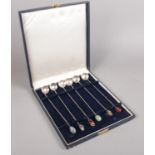 A set of 6 Brazilian silver 2000 reis coin spoons. With white metal twisted shafts and assorted