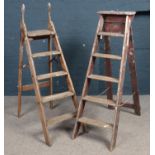 Two sets of decorators wooden step ladders.