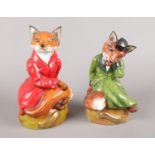 A pair of Bloor China (Stoke-On-Trent) Green and Red Seated Fox Figures. Red Figure - H:19cm Green