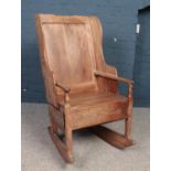 An 18th century elm rocking lambing chair with single drawer. Overall condition good. Just three