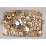 A tray of watch spares. Includes movements, dials, cases etc.