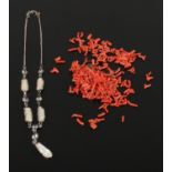 A cinnamon coral necklace together with a silver pendant necklace inset with mother of pearl and ice