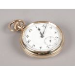A gold plated pocket watch. Arabic numeral markers and subsidiary seconds. Running.