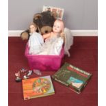 A box of toys. Includes dolls, board games etc.