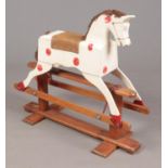 A vintage Leeway wooden rocking horse.