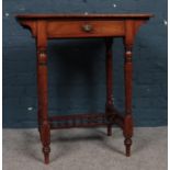 A Victorian Mahogany side table with drawer. To include turned legs joined by decorative H