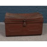 A vintage twin handled tin trunk.