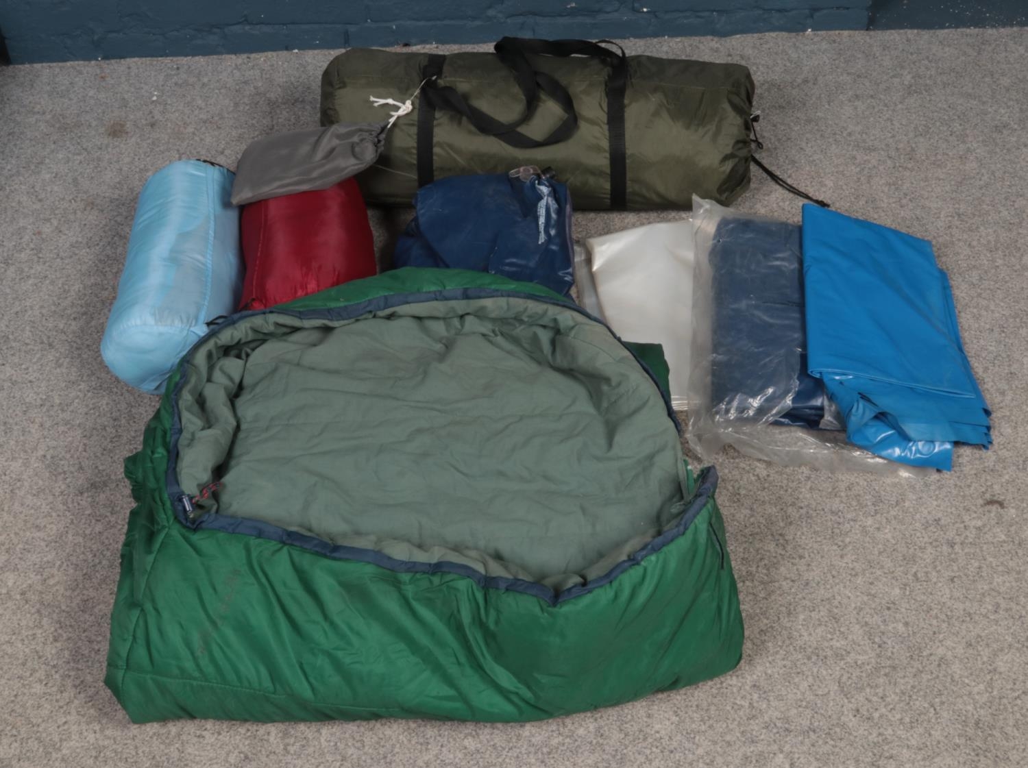 A vintage six man tent and contents. To include two mattresses and three sleeping bags etc.