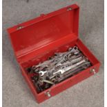 A metal tool box with contents of spanners.