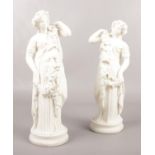 A pair of Bisque porcelain female figures. 27cm height.