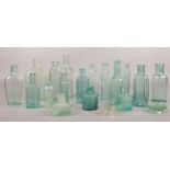 A collection of vintage glass/ chemist bottles.