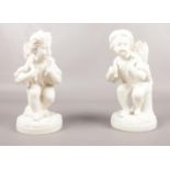 Two Parian Cherub figures. 19cm height.