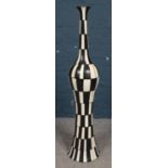 A large black and white floor standing vase. (124cm).