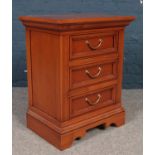 An Italian Selva yewood bedside chest of 3 drawers.