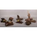 A collection of eight carved wood black forest bears. bear holding brass bowl example.