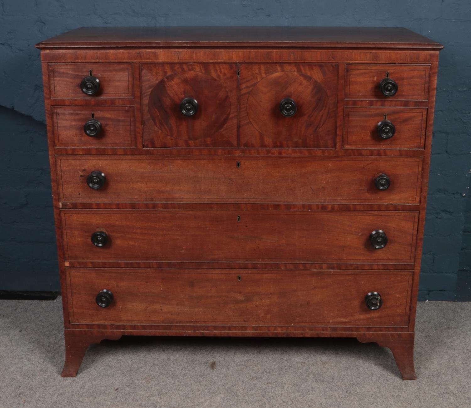 A George III mahogany secretaire chest of drawers. (116cm x 125cm x 57cm). Back leg off. Damage to