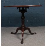 A George III Mahogany pedestal snap top table. Comprising of a rotating birdcage mechanism. H:70cm