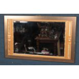 A modern gilt framed beveledge wall mirror. (73cm x 118cm)