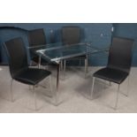 A chrome and glass dining table with 4 matching leatherette dining chairs. (76cm x 140cm x 80cm)