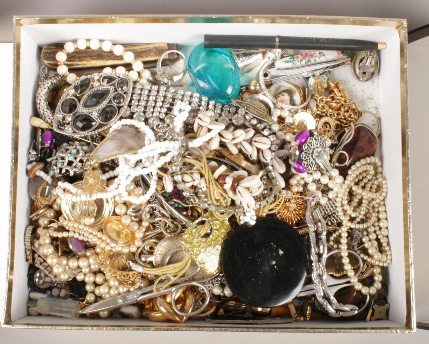 A box of mostly costume jewellery. Including small quantity of silver jewellery, beads, earrings,