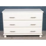 A painted pine chest of 3 drawers. (68cm x 100cm x 49cm)