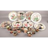 A quantity of Royal Doulton character jugs and cabinet plates. Including Mine Host, Mad Hatter,