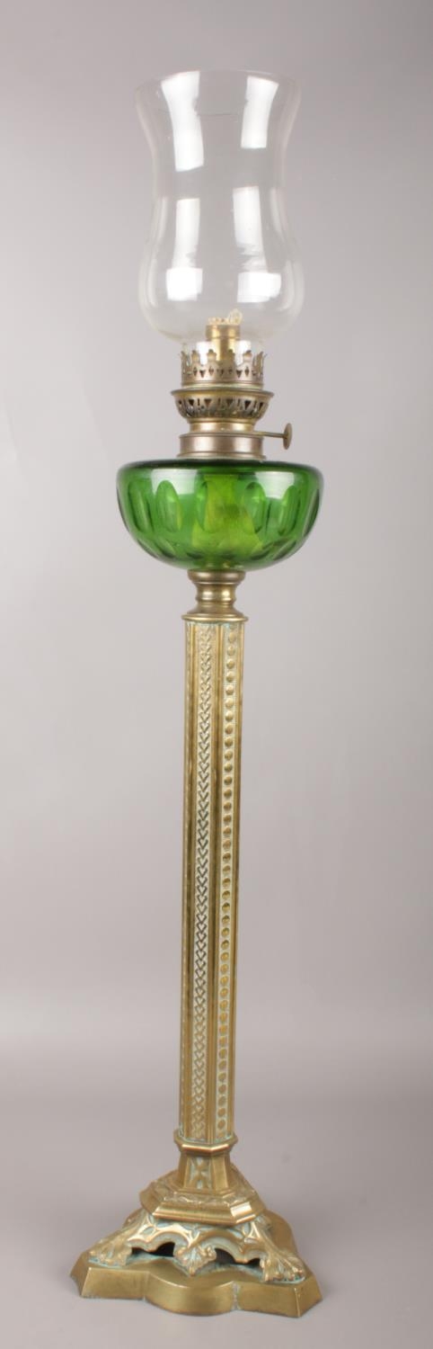 A Victorian brass & glass oil lamp. 83cm height.