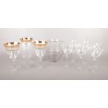 Eleven various etched wine glasses together with a jug. To include three gilt edged goblets etc.