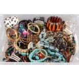 A large box of costume jewellery. Including beads, bangles, necklaces,