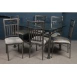 A metal and bevel edge glass dining table with 6 matching chairs. (76cm x 152cm x 92cm)