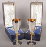 A cased pair of commemorative silver and gilt metal goblets. Assayed Sheffield by H L Brown & Son.