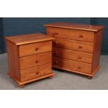 A pine chest of 4 drawers along with a matching bedside cabinet.