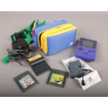 A Nintendo Game Boy Color. Includes games and accessories in case.
