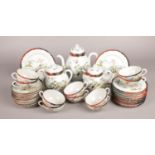 A Thirty-Five Piece Oriental Tea Service. Comprising of: Teapot, Milk Jug, Sugar Bowl and Ten Cups