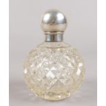 A silver top globular scent bottle. Missing stopper. Some denting to silver. Hallmarks partially