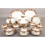 A Shore & Coggins Superior Bell China Tea Service. To include a two serving plates, twelve side