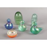A group of glass paperweights. Victorian glass dumps, iridescent ducks and a John Deacons millefiori
