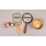 A small selection of wooden items. To include two wooden bevelled edged vanity mirrors, a turned