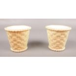 Two Royal Worcester blush ivory baskets. G857 stamped marks to base. 8cm height.
