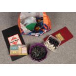 A bag of toys and games. Includes Lego, toy soldiers, Chess and Monopoly.