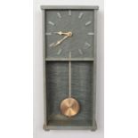 A Modern slate pendulum wall clock. (43cm height, 18cm width)