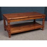 A stained pine coffee table. 45.5cm H 105cm W 53cm D