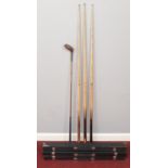 Three cased snooker cues along with a Wooden golf club. Including Sugg Sport example, etc.